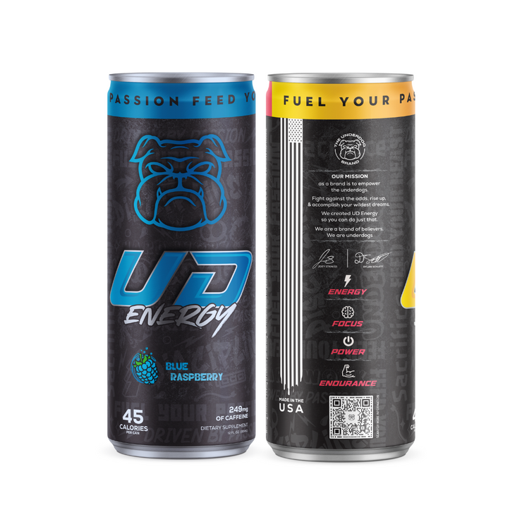 Two UD Energy Performance Beverage cans with the flavors Blue Raspberry and Strawberry Lemonade. The left can has a dark blue background featuring a stylized light blue bulldog logo and the flavor "Blue Raspberry" indicated with a blueberry icon. It has key details like "45 calories" and "249mg of caffeine." The right can, Strawberry Lemonade, follows a similar design with a black background and text highlighting the product&